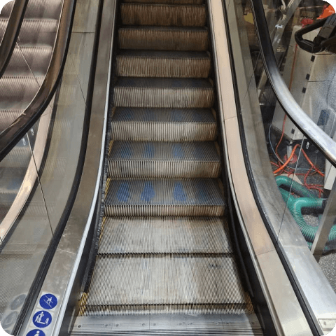 industrial cleaning - removing dirt, grease, and contaminants from escalator
