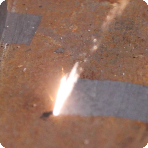 rust removal in progress laser close up shot